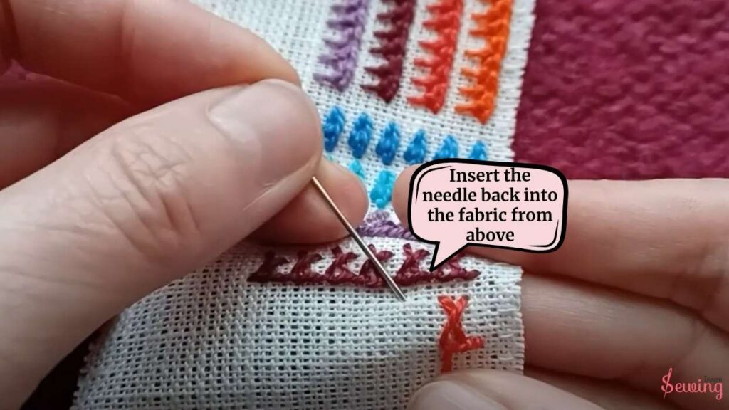 insert the needle back into the fabric from above