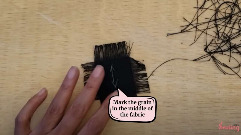 mark the grain in the middle of the fabric