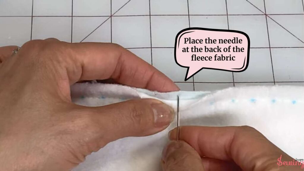 place the needle at the back of the fleece fabric