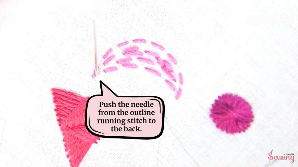 Push the needle from the outline running stitch to the back