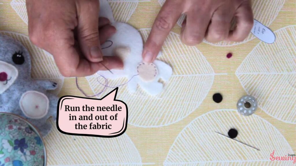 Run the needle in and out of the fabric