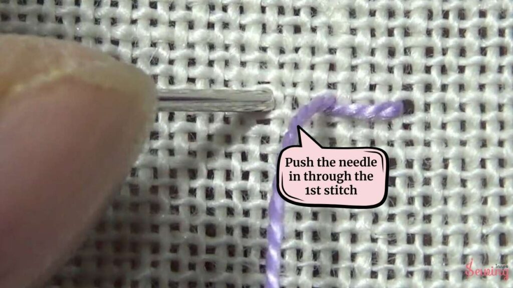 push the needle in through the 1s stitch