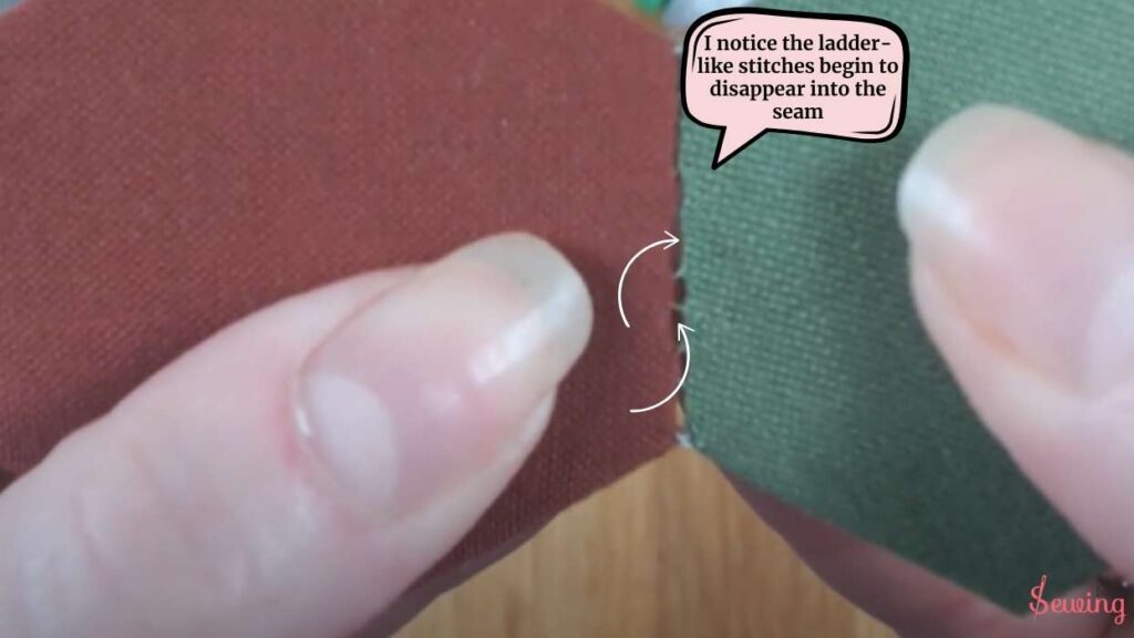 I notice the ladder-like stitches begin to disappear into the seam