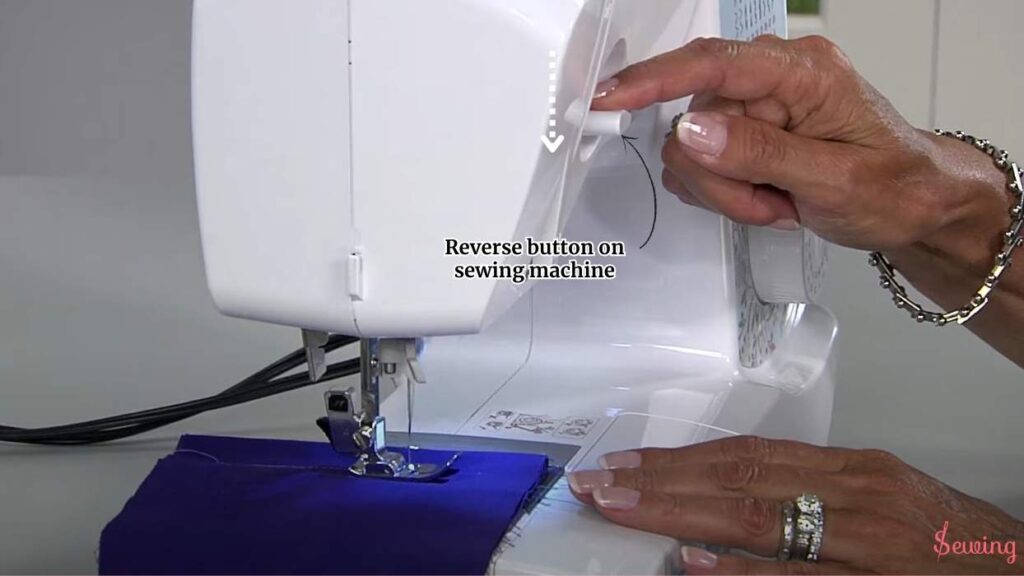 Reverse button on sewing machine